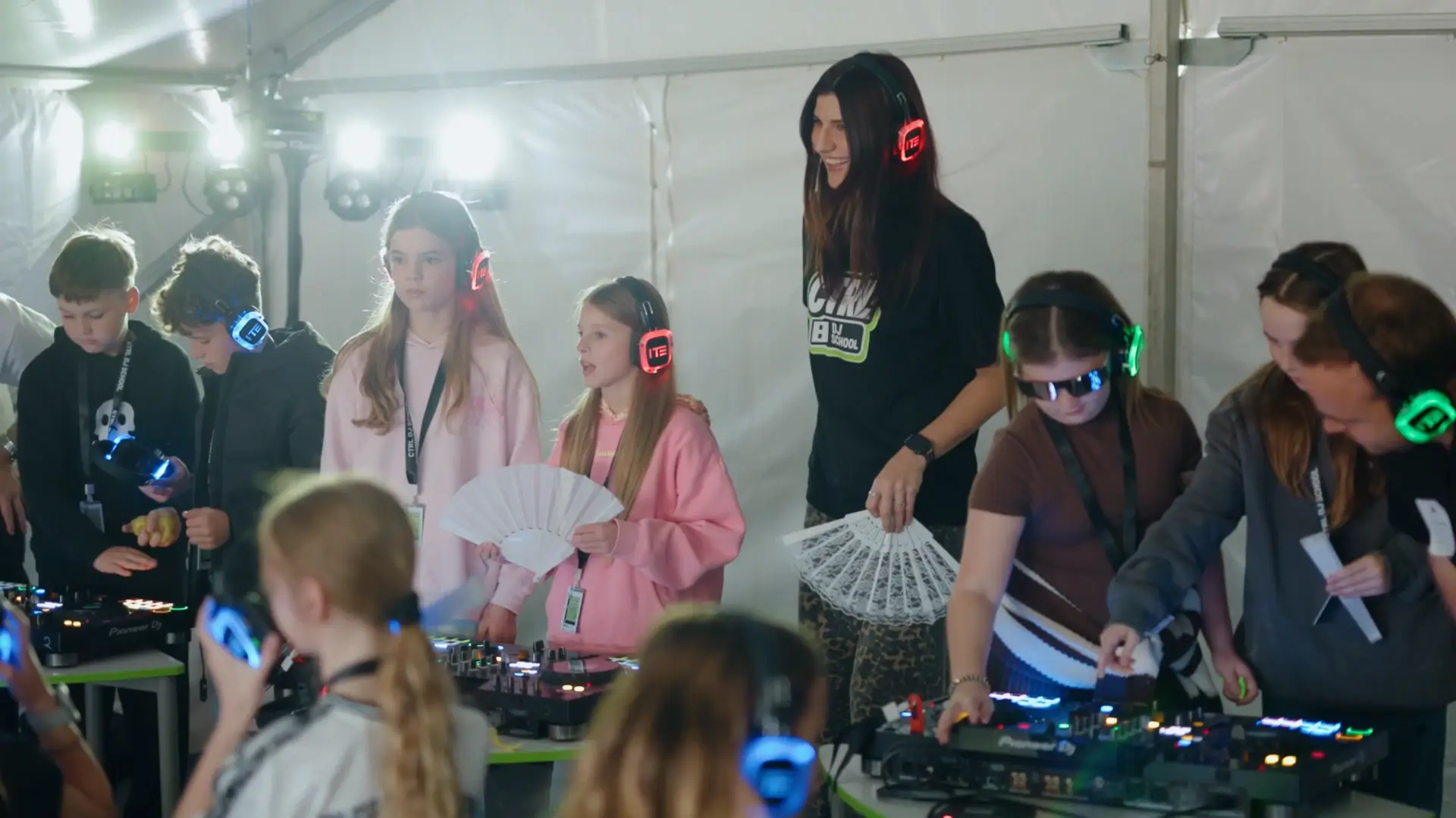 Miss Tash supporting young DJs during a live event